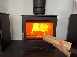 Round wood briquette near a stove
