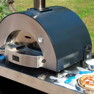 Alfa Classico 2 Pizze Hybrid Gas pizza oven with a pizza on a wooden table