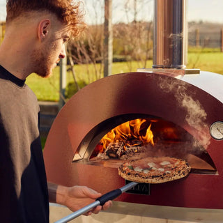 Alfa Moderno 2 Pizze Wood Fired Pizza Oven in Antique Red with flames and fired pizza