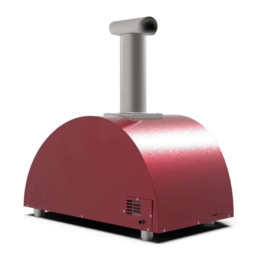 Alfa Moderno 3 Pizze Hybrid Pizza Oven in Antique Red with a silver chimney on a white background side back view