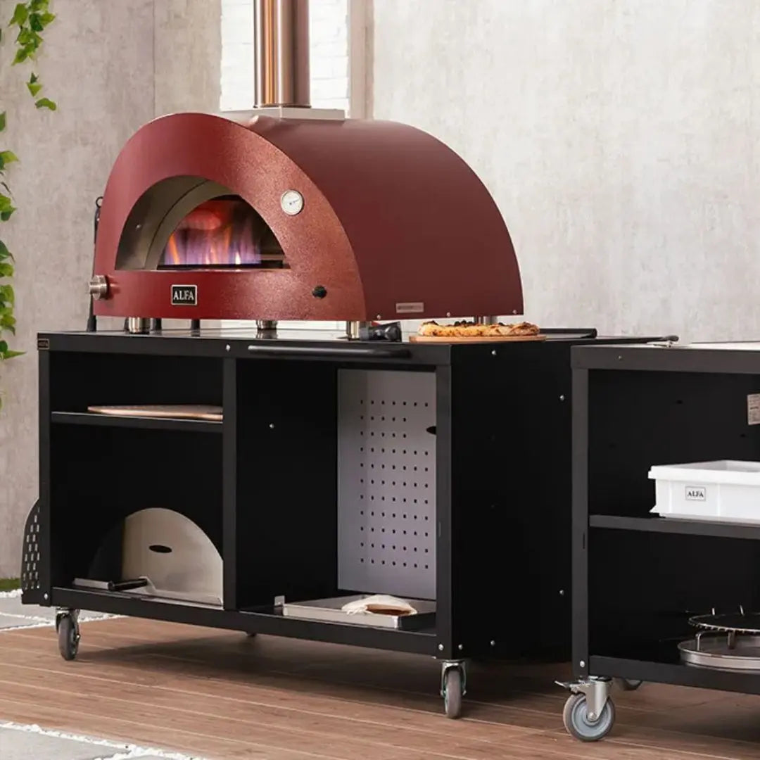 Alfa Pizza Oven Modular Cooking Station 160 on a stand with shelves in an outdoor setting.