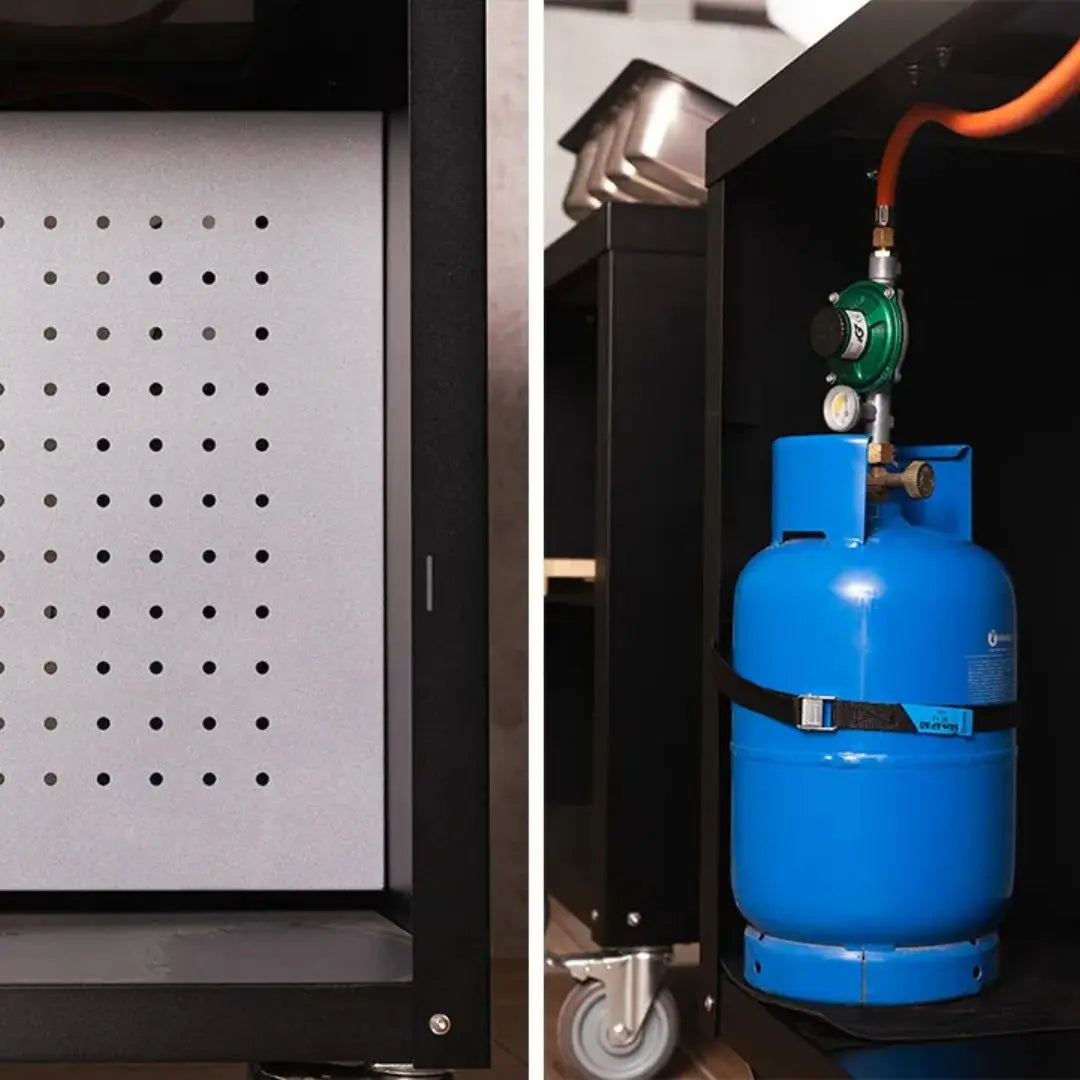 Blue propane tank attached to Alfa pizza oven with a perforated wall in the background.