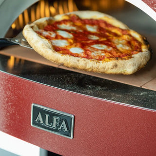 Antique Red Alfa Moderno Pizze Hybrid Gas Pizza Oven with a cooked pizza being taken out