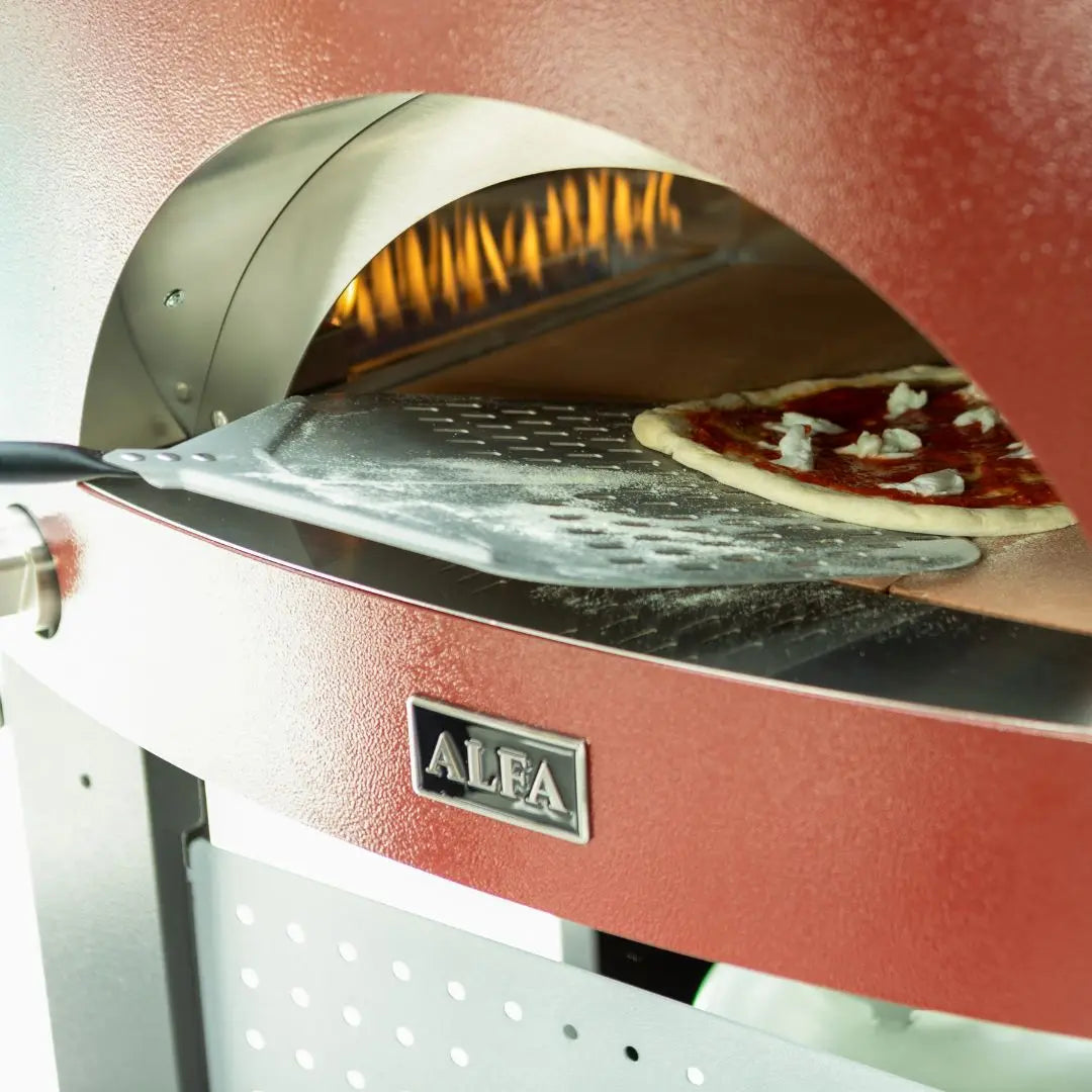 Antique Red Alfa Moderno Pizze Hybrid Gas Pizza Oven with a pizza cooking