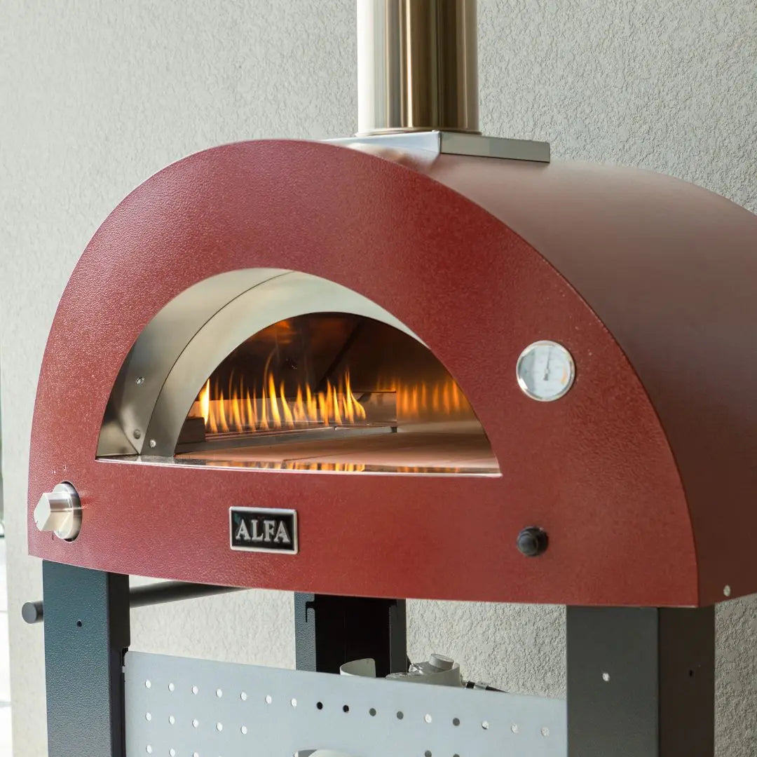 Antique Red Alfa Moderno Pizze Hybrid Gas Pizza Oven with a silver chimney outside