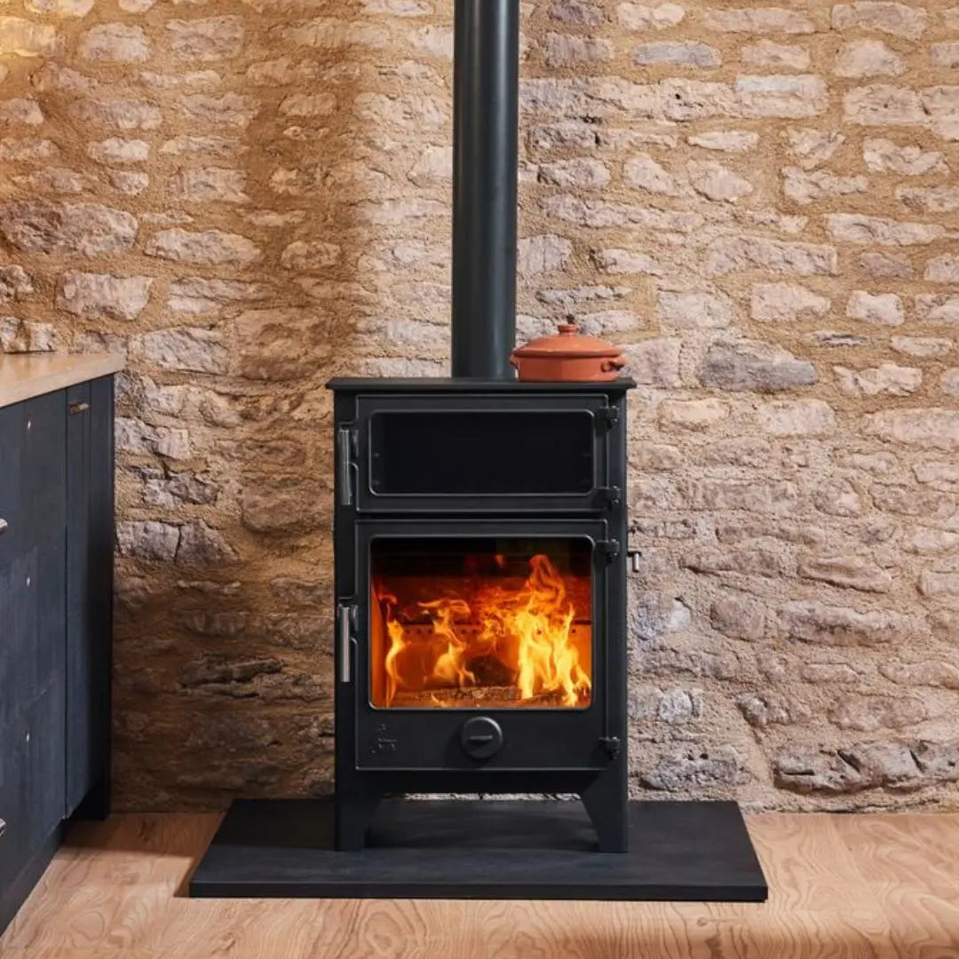 Dean Forge Baker 8 Eco Baking Stove - 8kW standard height with stone background in kitchen