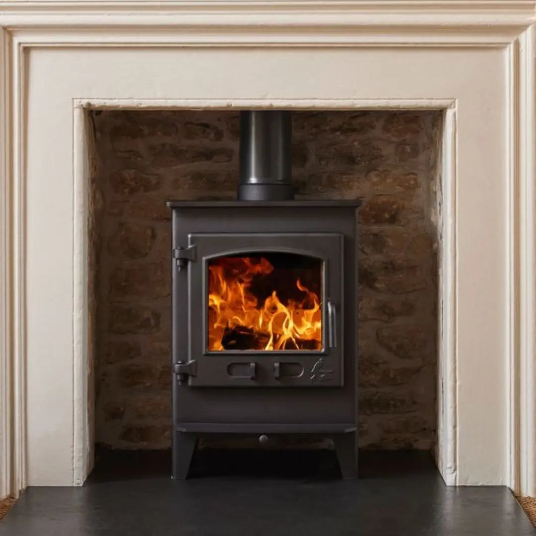 Dean Forge Croft Junior Eco Stove - 5kW close up in fireplace surround