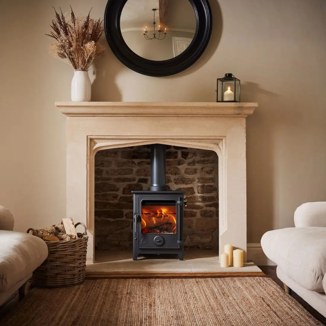 Dean Forge Dartmoor 5 Eco Log Burner Stove in brick fireplace with marble surround in living room