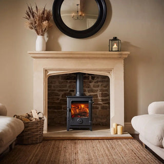 Dean Forge Dartmoor 5 Eco Log Burner Stove in brick fireplace with marble surround in living room