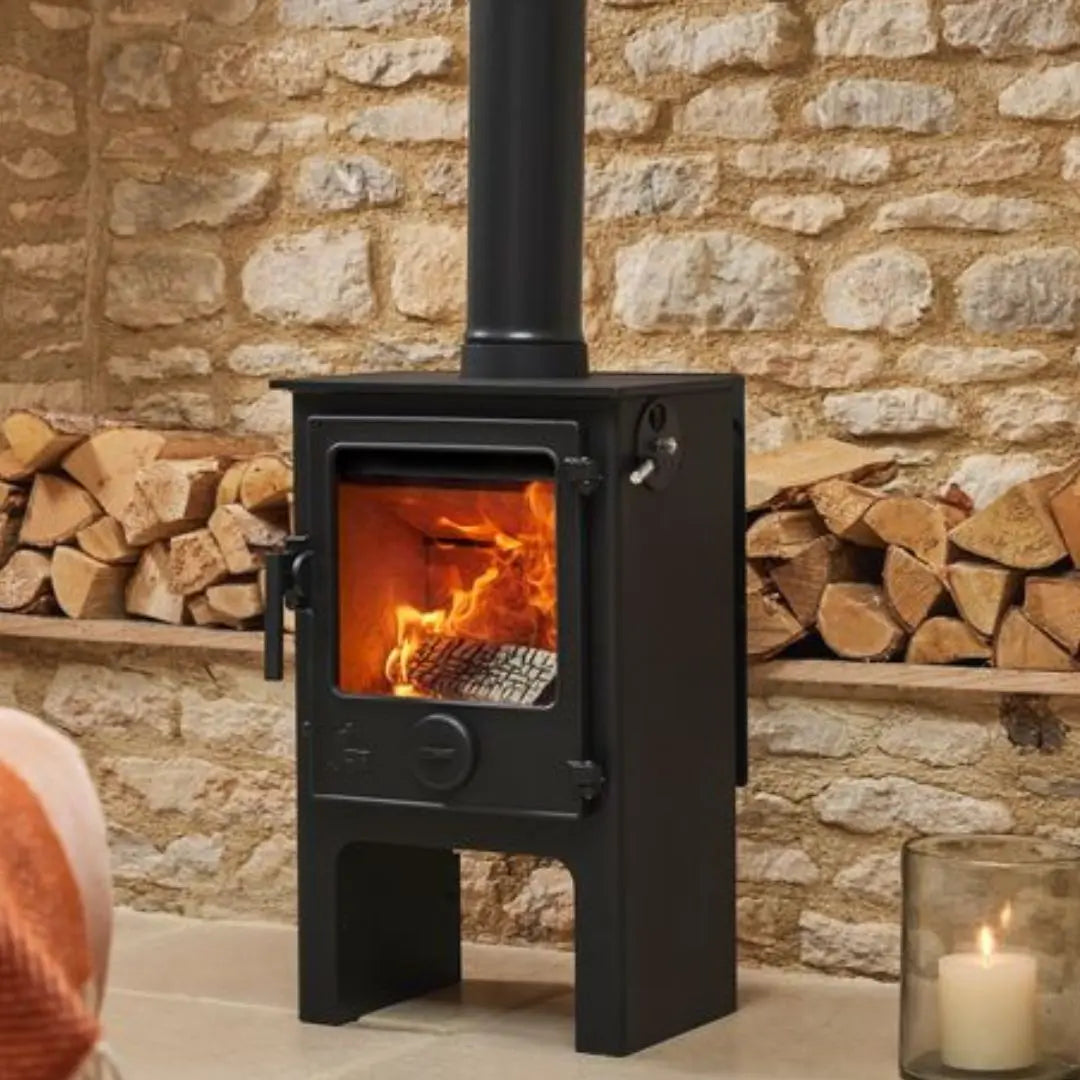 Dean Forge Dartmoor 5 Midi Eco Stove - 5kW with stone wall and stacked logs