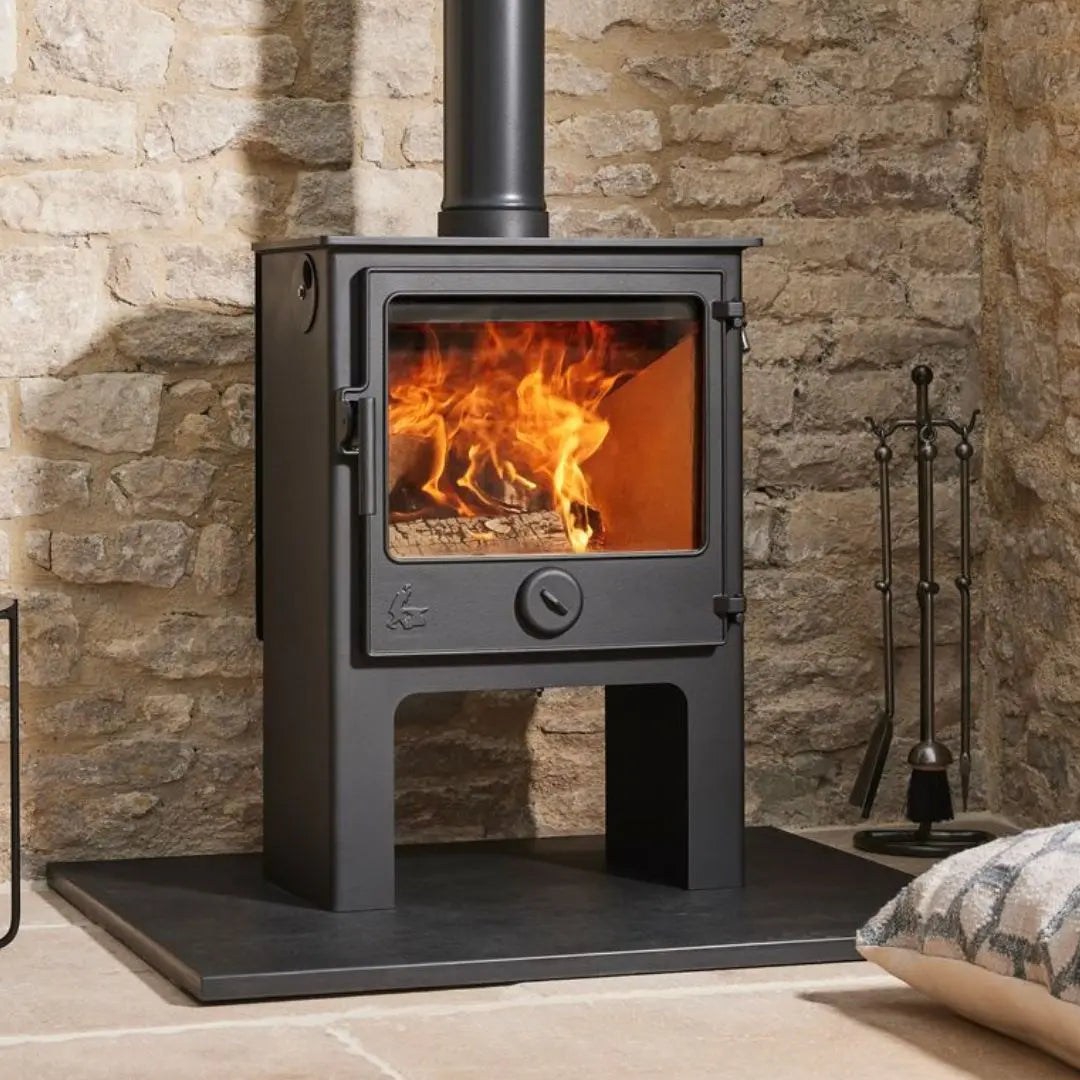 Dean Forge Dartmoor W5 Eco High Stove - 5kW on black hearth with stone wall