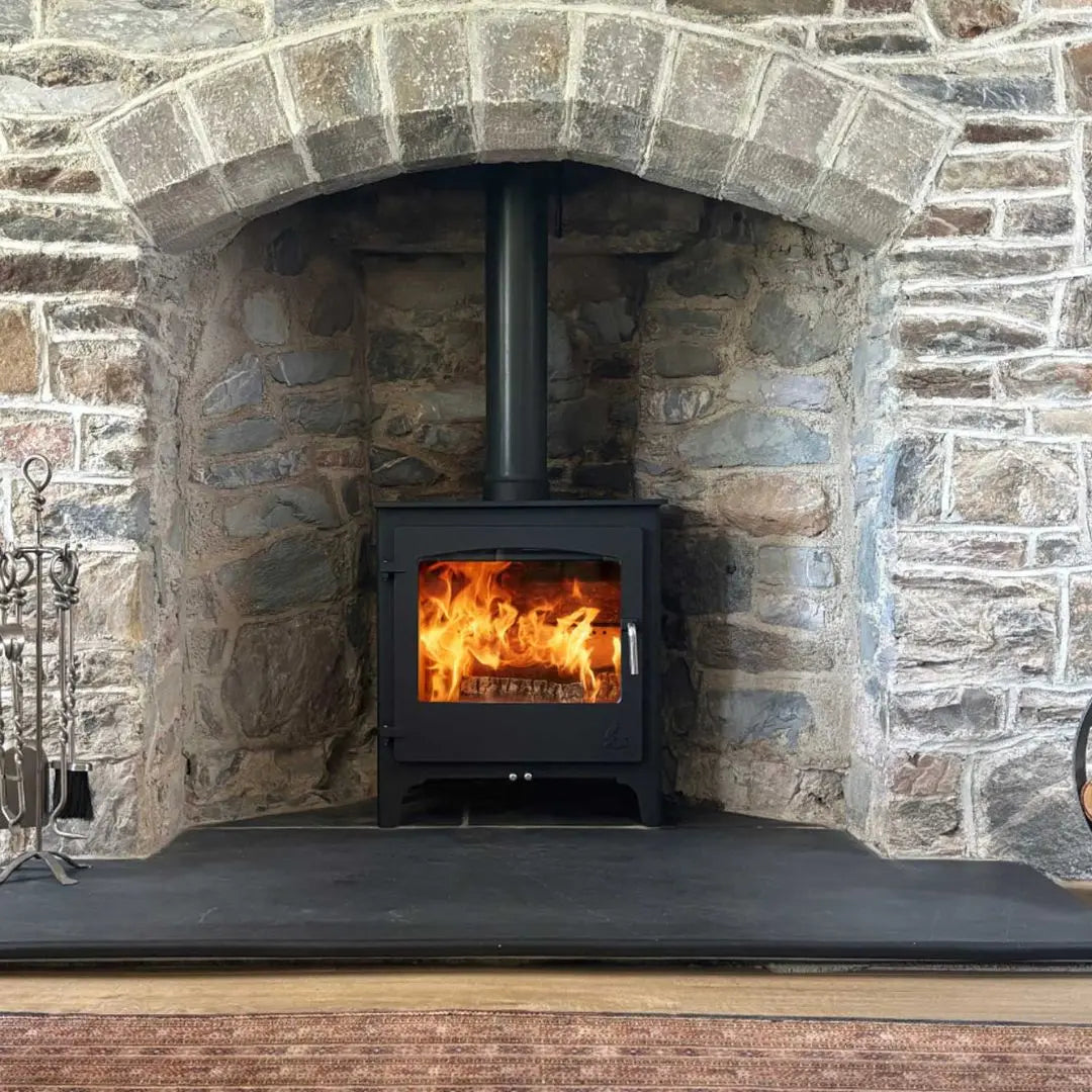 Dean Forge Dean Burn Slimline 5 Eco Stove - 5kW in stone fireplace