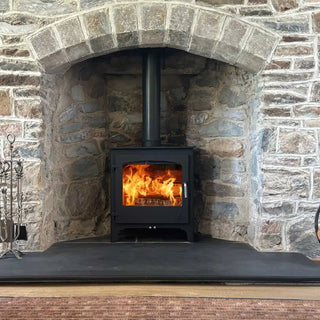 Dean Forge Dean Burn Slimline 5 Eco Stove - 5kW in stone fireplace