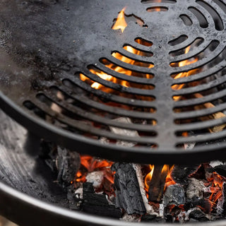 Close-up of Dean Forge Moorland Firebowl and Swing Arm Set with flames and glowing embers