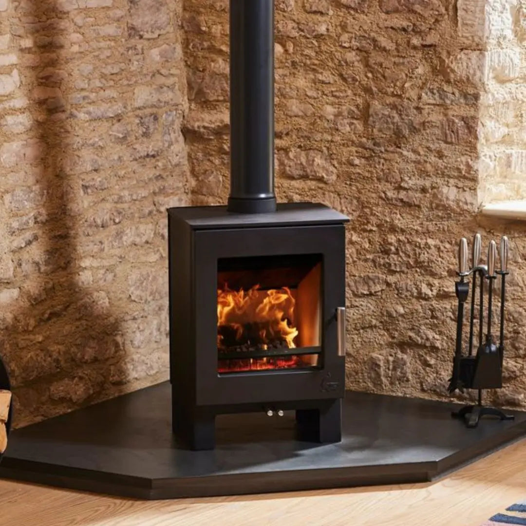 Dean Forge Sherford 5 Eco Stove - 5kW on corner hearth with flue against stone wall