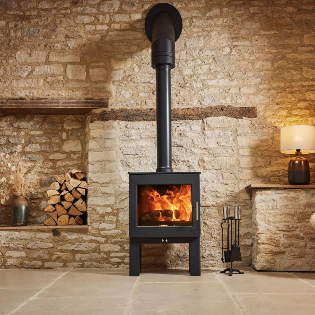 Dean Forge Sherford 8 Eco High Stove - 8kW on tiled floor with stone background