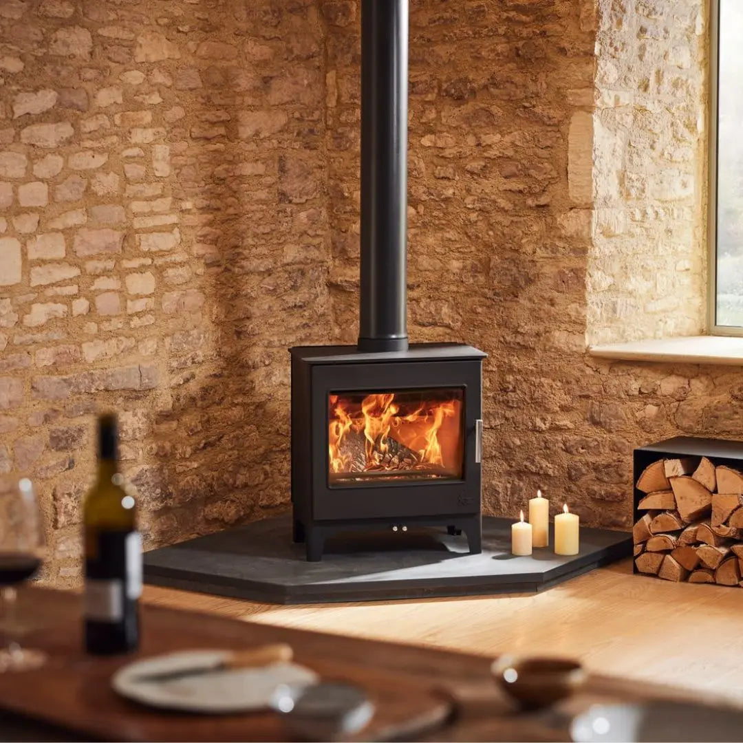 Dean Forge Woodbury 8 Eco Stove - 8kW on corner hearth against stone wall