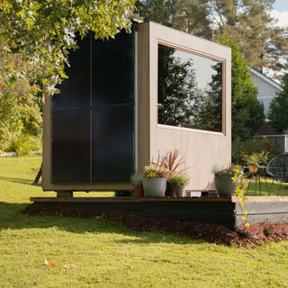 Kirami Finvision Zero Medium Sauna Solar Oak with solar panels on the side