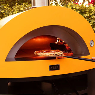 Yellow Alfa Moderno 5 Pizze Wood Fired Pizza Oven with pizza on peel