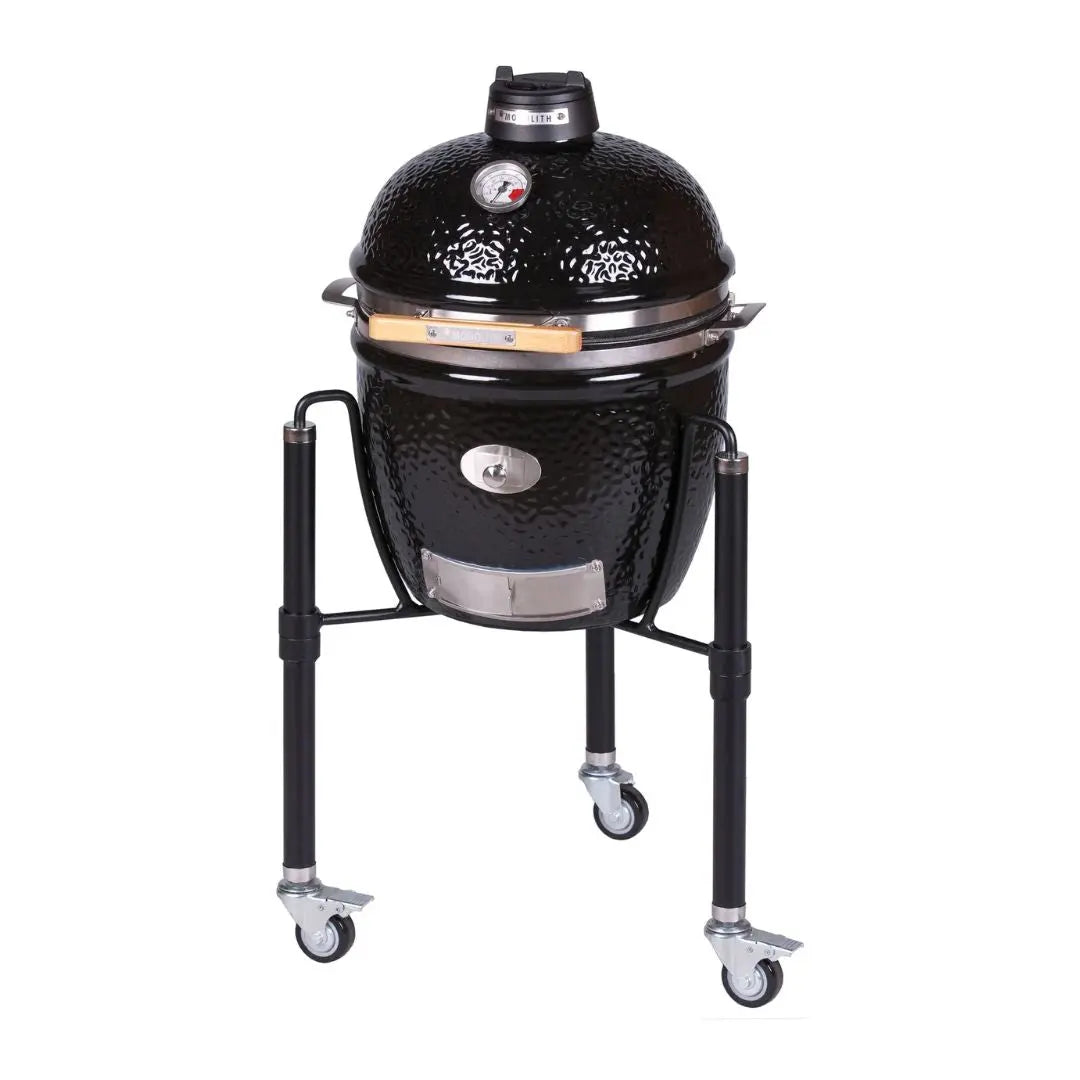 Monolith JUNIOR 2.0 47cm Black Kamado grill on cart on a white background