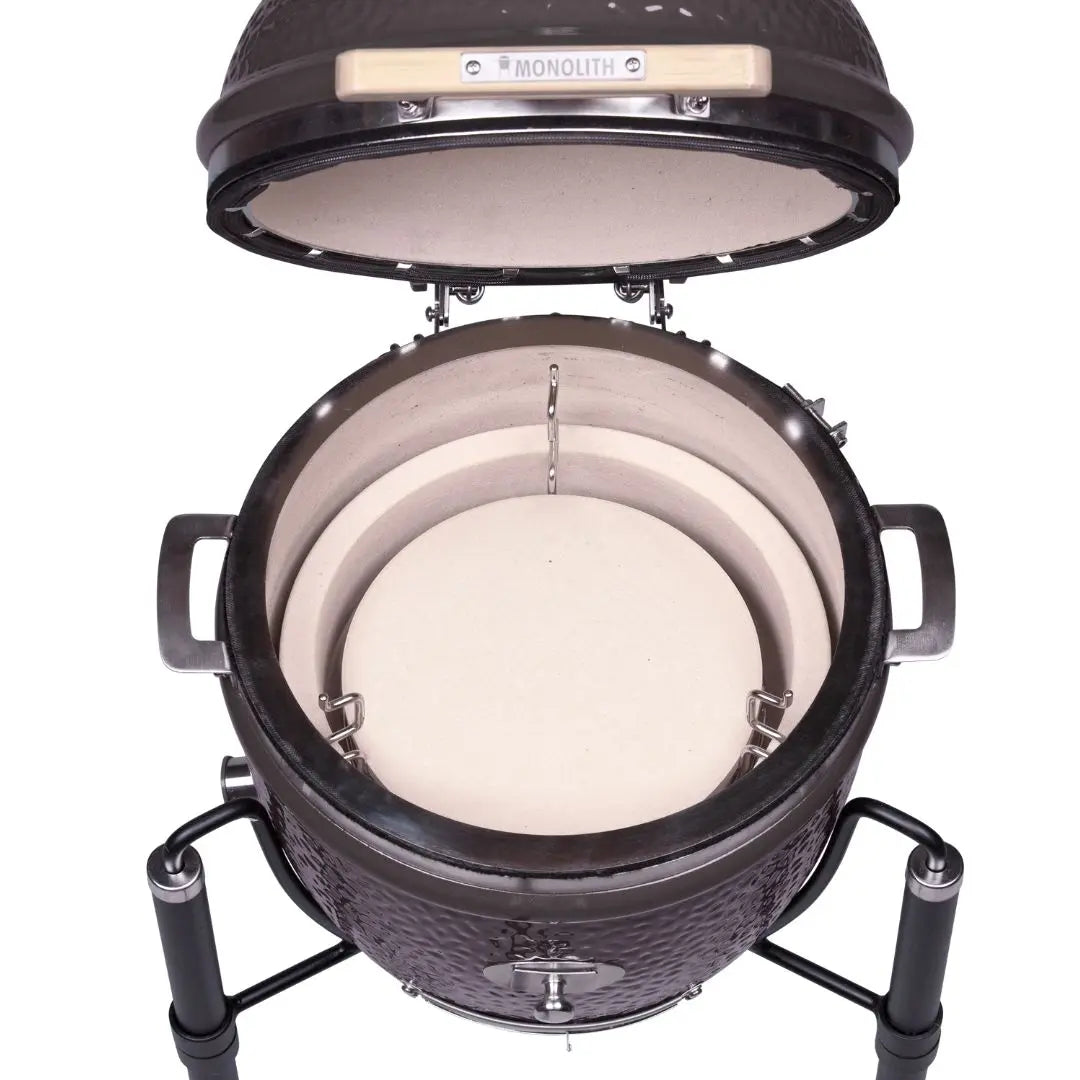 Monolith JUNIOR 2.0 47cm Black Kamado grill on cart on a white background