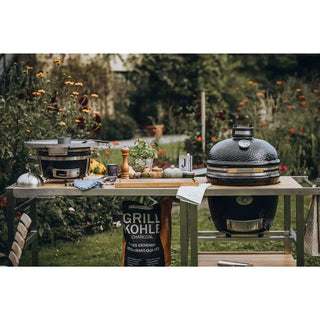 Monolith Kamado Grill .55 .66Buggy Extension Table with cooking ingredients and utensils