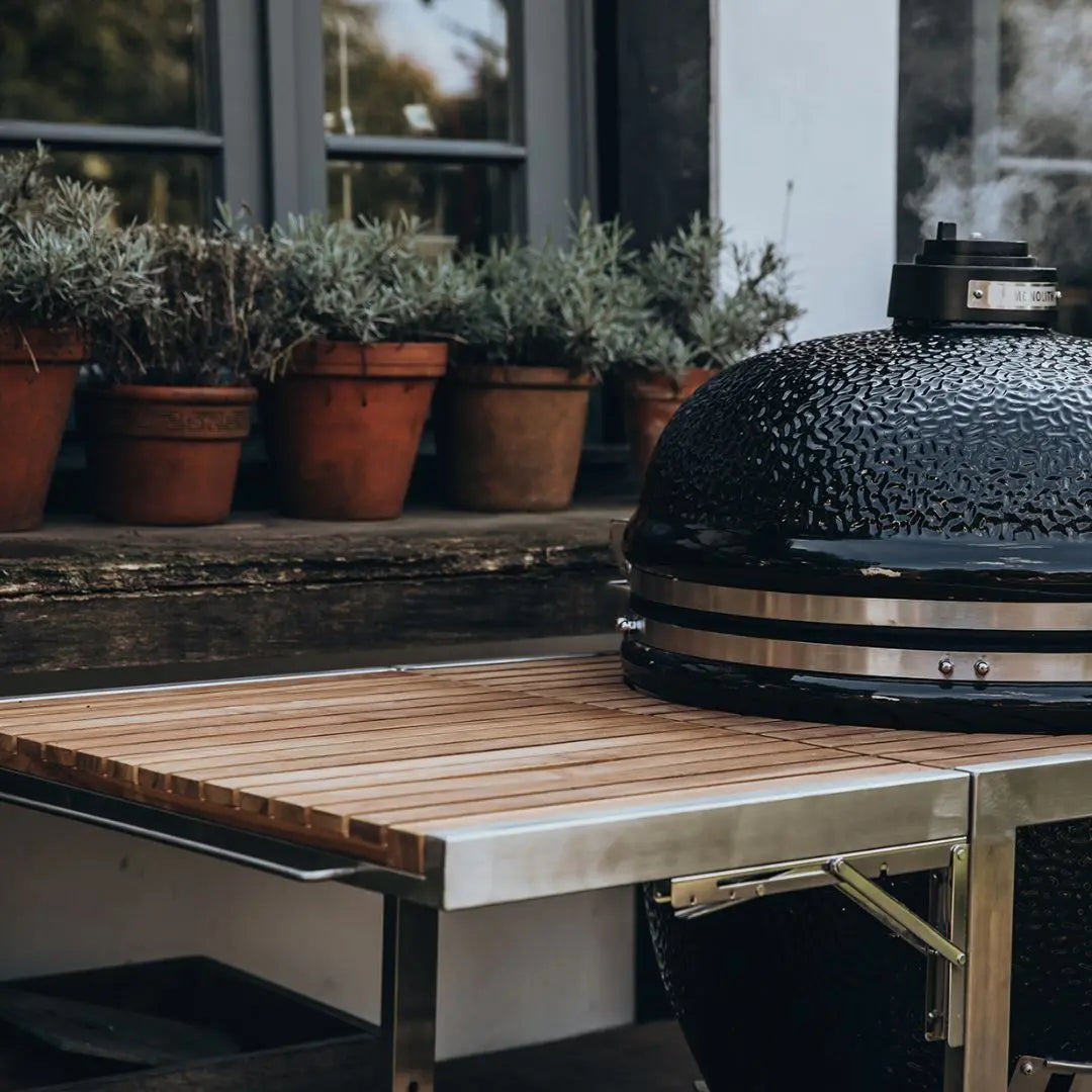 Monolith Kamado Grill BuggyTrolley .55 with grill on garden patio
