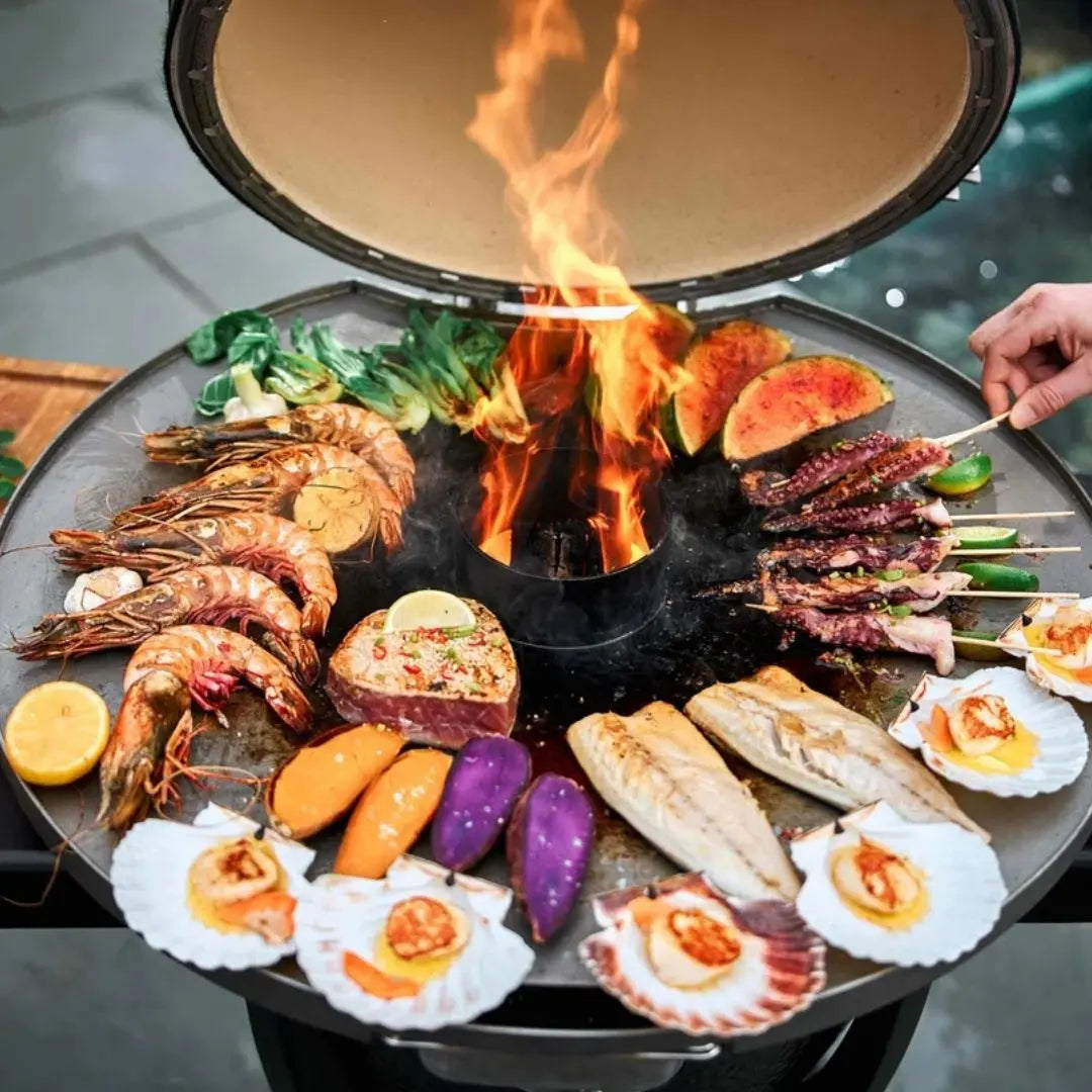 Monolith Kamado Grill Fireplate setup with seafood and vegetables cooking
