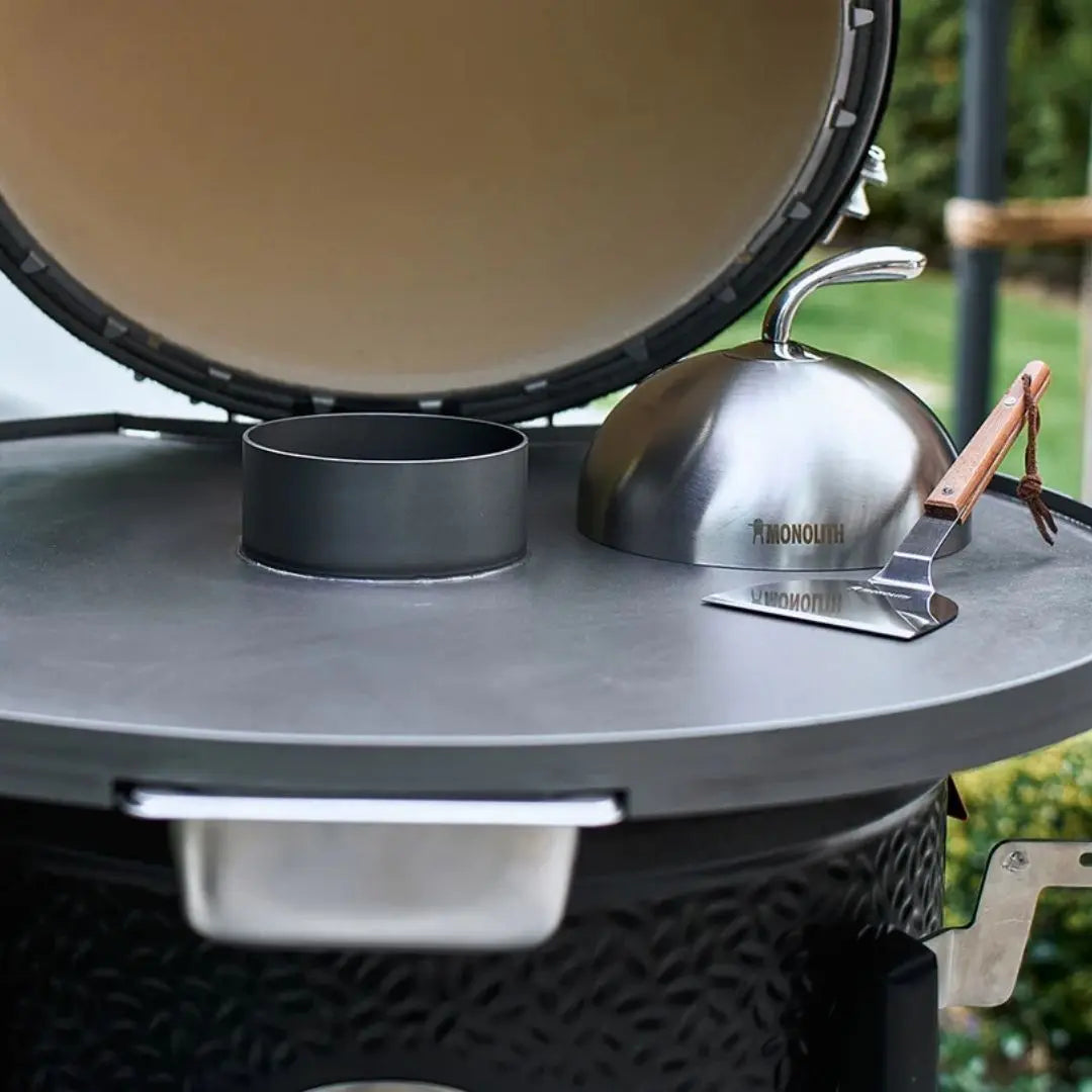 Monolith Kamado Grill Fireplate closeup with cloche and spatula
