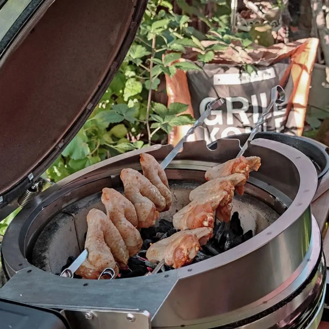 Monolith Kamado Grill Rotisserie closeup of chicken wings roasting
