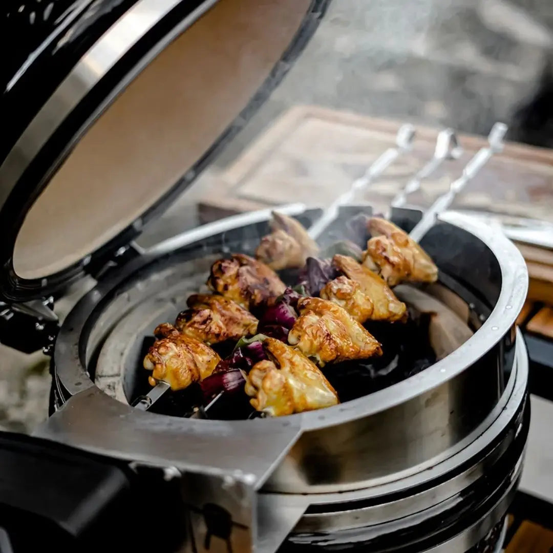 Monolith Kamado Grill Rotisserie chicken skewers roasting
