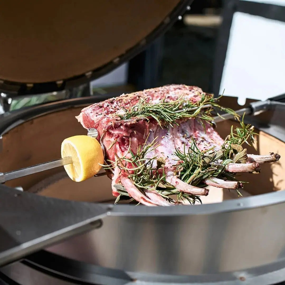Monolith Kamado Grill Rotisserie rack of ribs closeup roasting