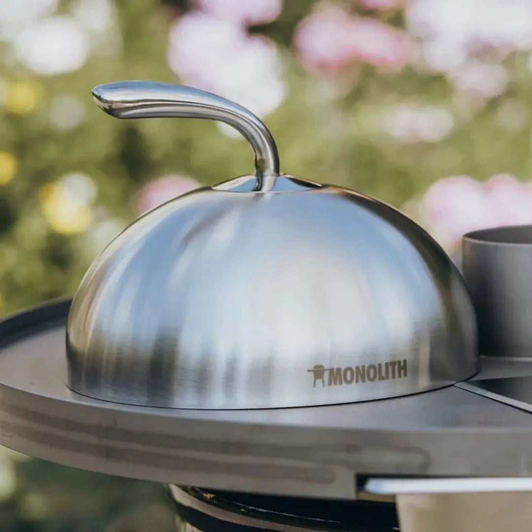 Monolith Kamado Grill Stainless Steel Cloche on table