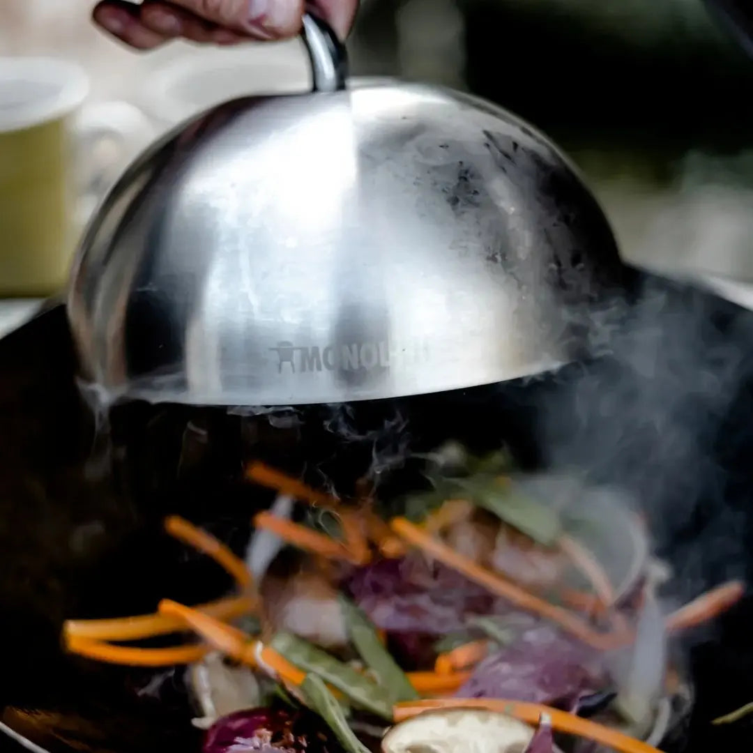 Monolith Kamado Grill Stainless Steel Cloche covering vegetables