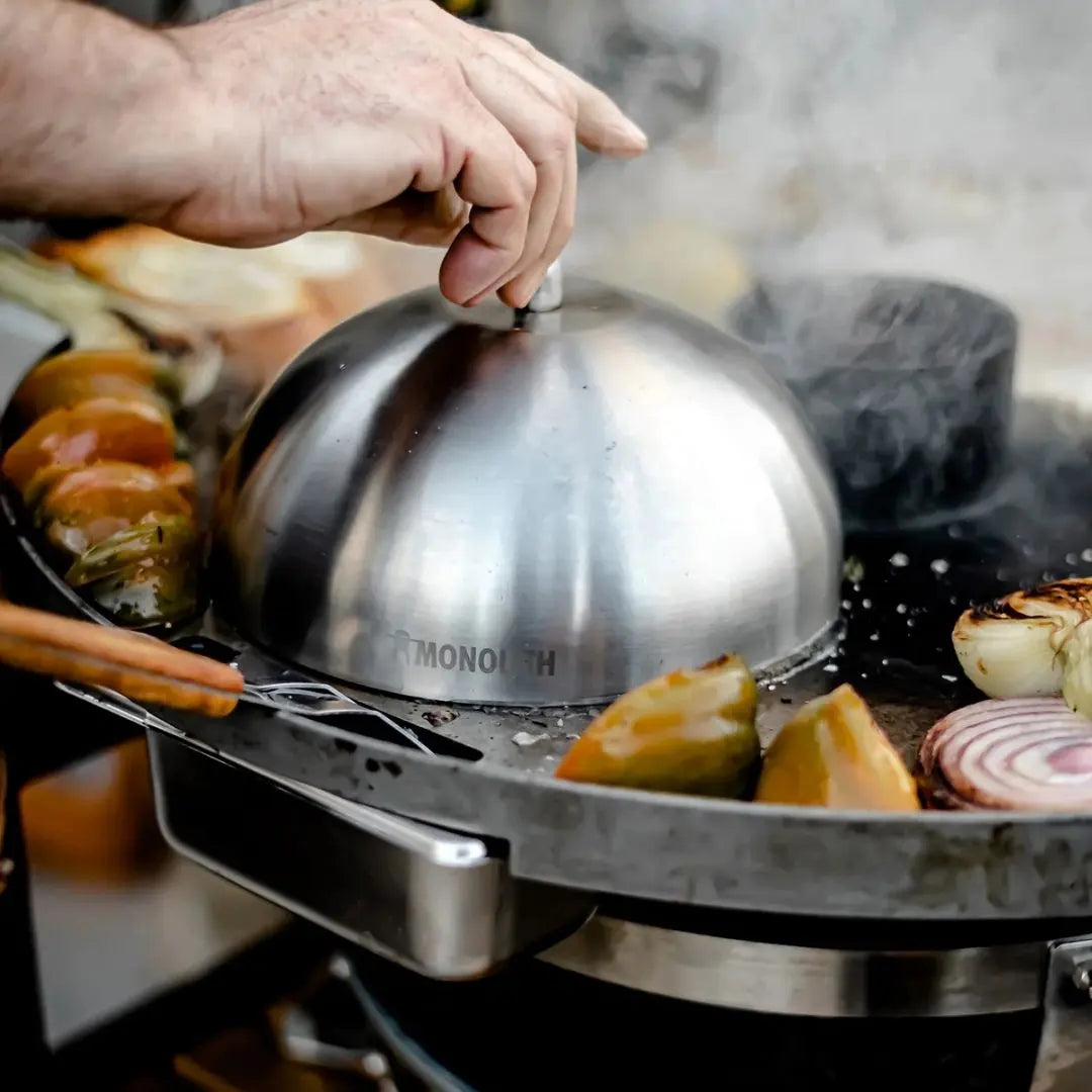 Monolith Kamado Grill Stainless Steel Cloche covering vegetables
