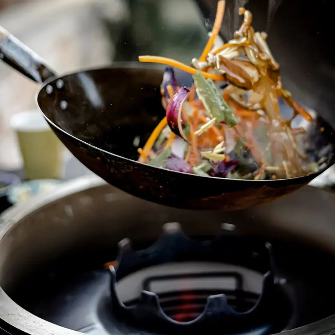 Monolith Kamado Grill Wok Pan stir frying vegetables