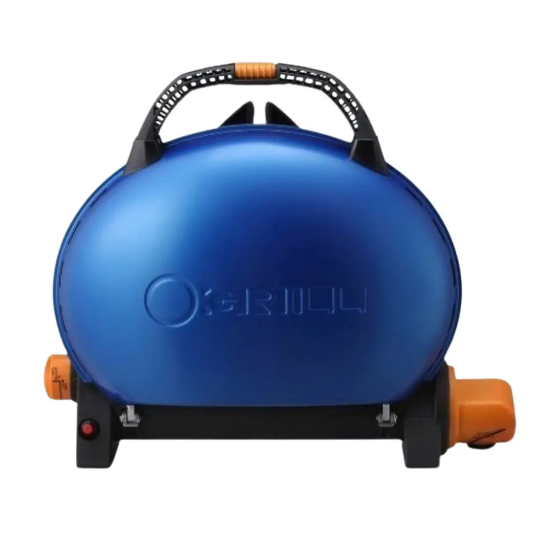 Blue O-Grill portable gas camping grill with black handle and orange accents on a white background