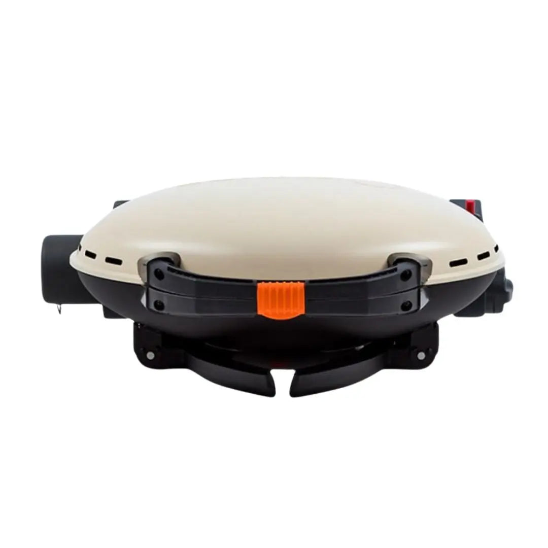 Portable O-Grill with beige top and black base on a white background