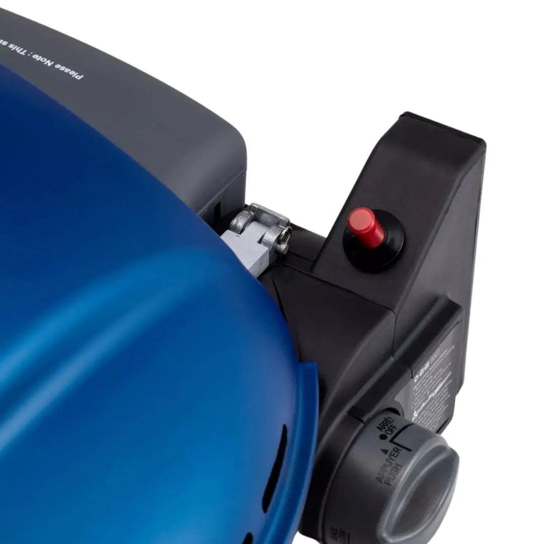 Close-up Piezo ignition on blue O-Grill 600 Portable Gas Grill