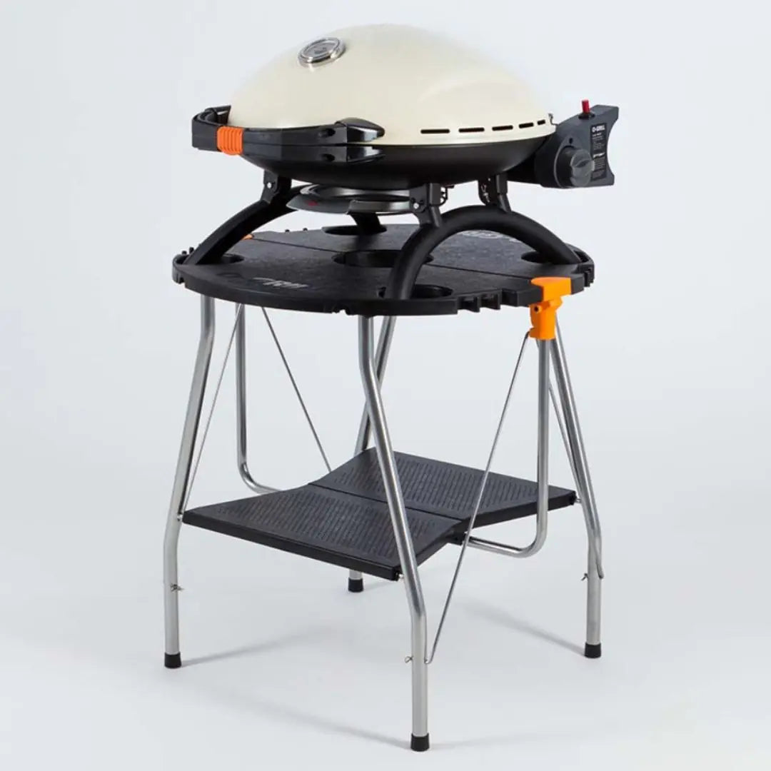 O-Grill 900 Cream Portable Gas Grill BBQ on Folding Table