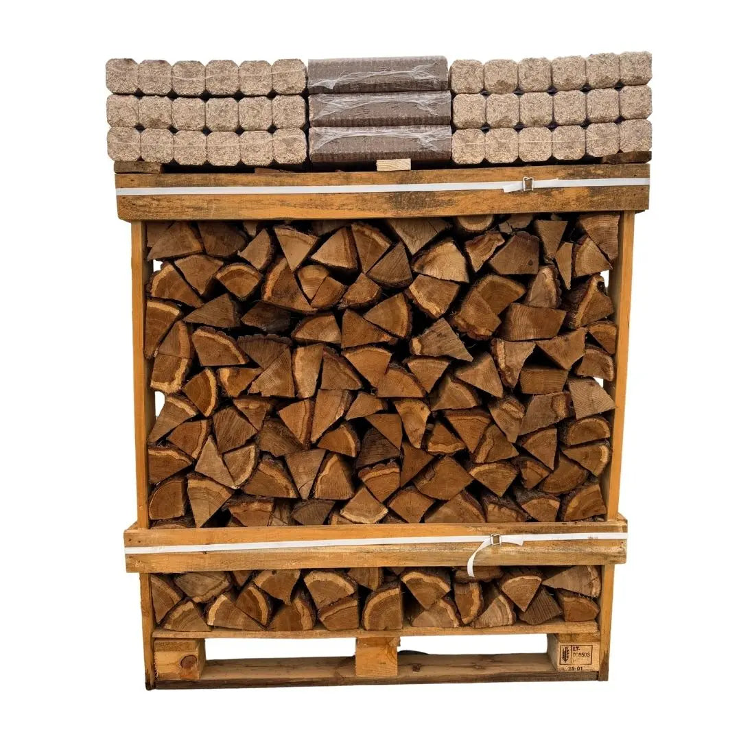 Stack of chopped wood on a wooden pallet with additional logs stacked above on a white background