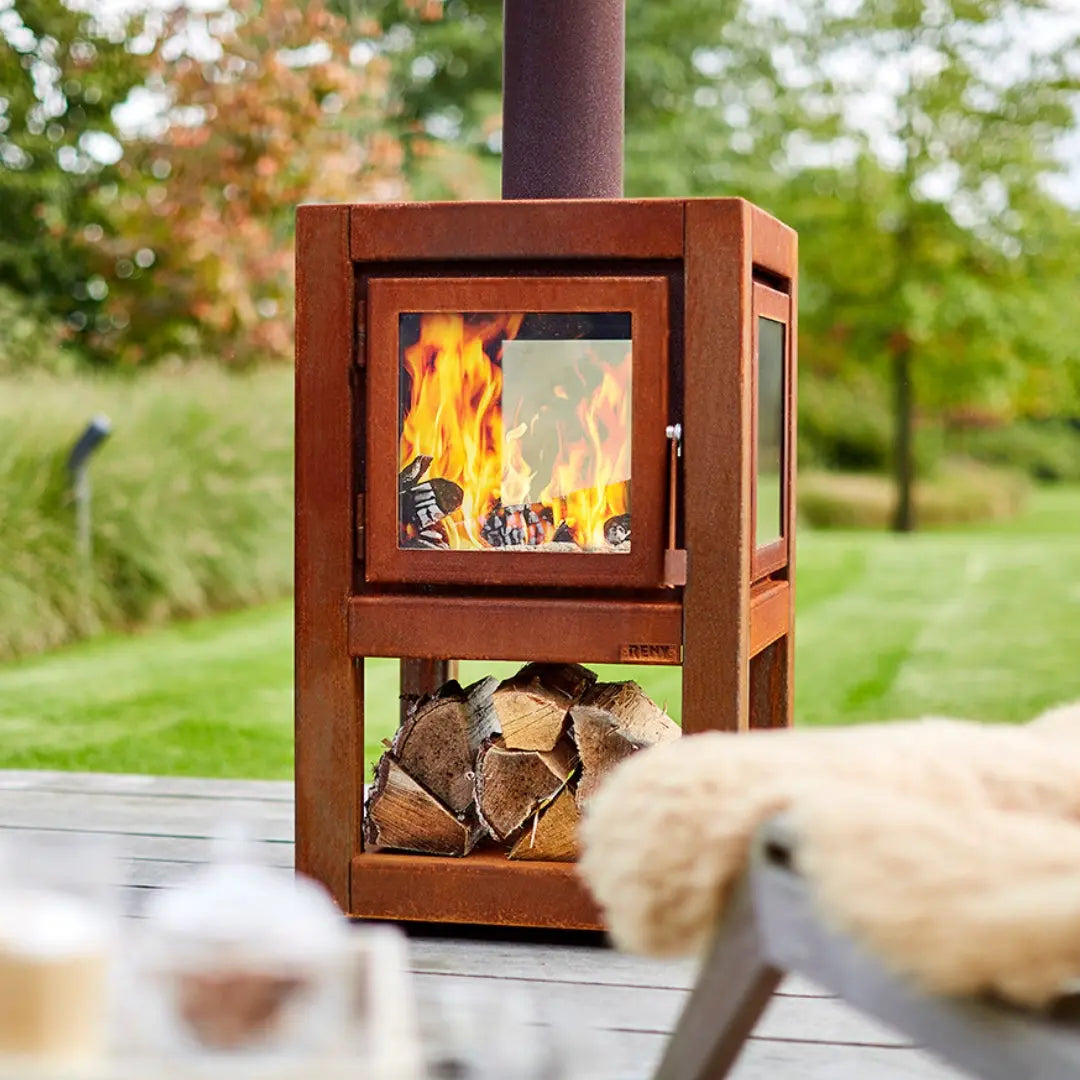 RB73 Quaruba L Mobile Outdoor Fireplace – CorTen Steel Wood Burner on outdoor patio setting