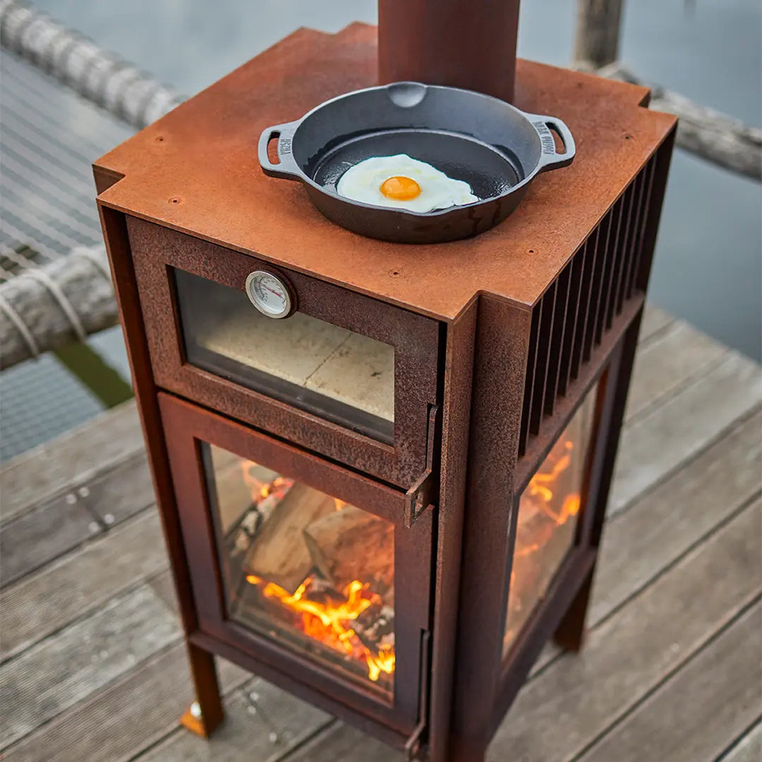 RB73 Quercus CorTen steel outdoor fireplace and oven on decking setting