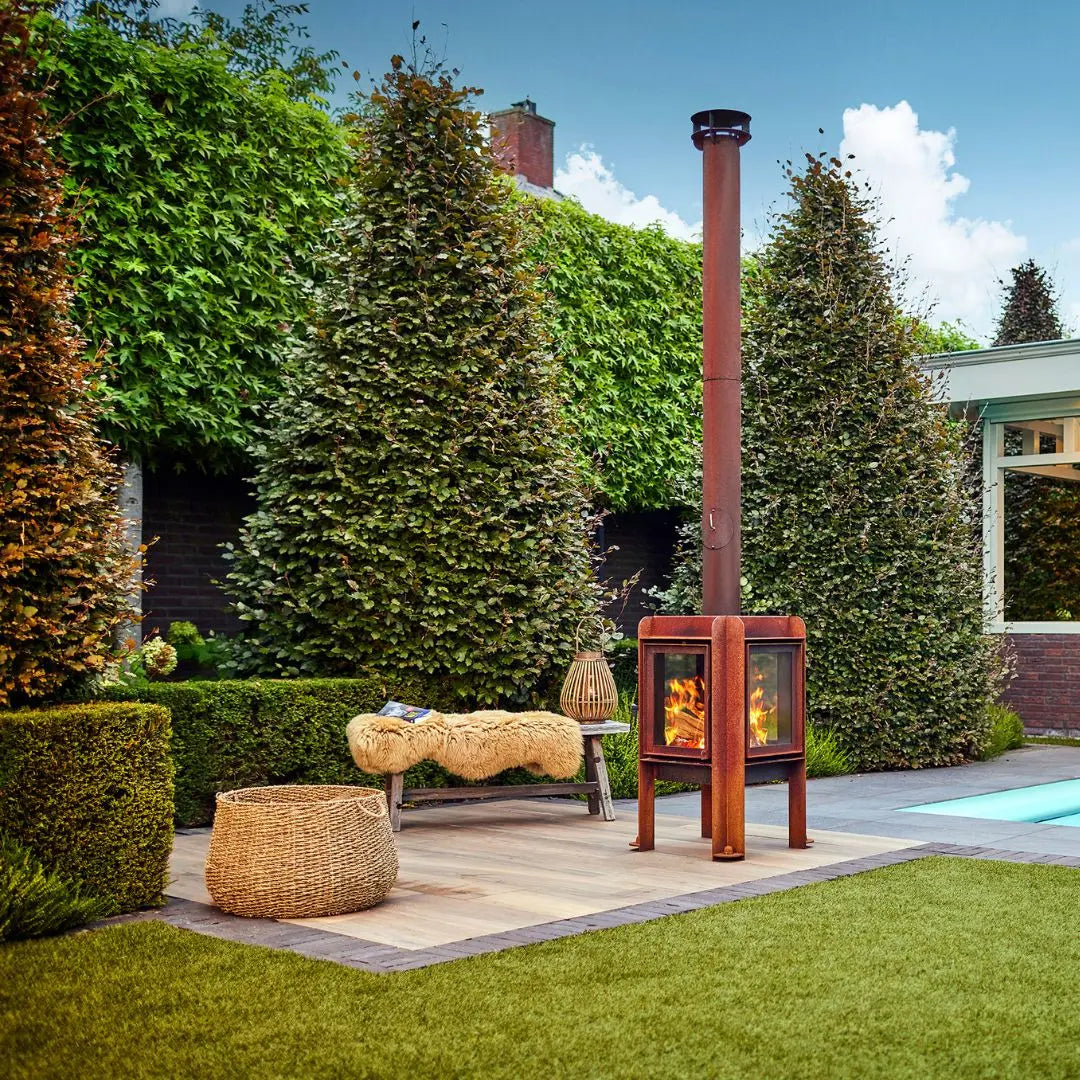 RB73 Fennek 50 Outdoor Fireplace - Compact CorTen Steel Wood Burner on outdoor patio setting