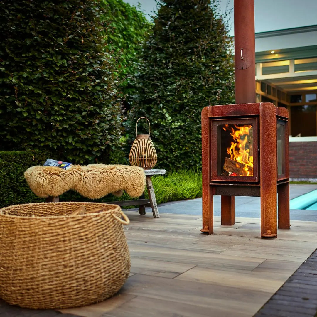 RB73 Fennek 50 Outdoor Fireplace - Compact CorTen Steel Wood Burner on outdoor patio setting
