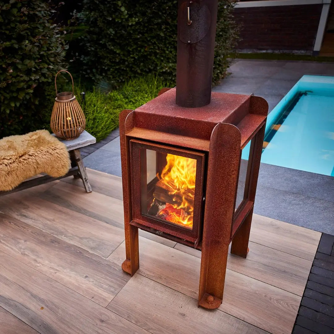 RB73 Fennek 50 Outdoor Fireplace - Compact CorTen Steel Wood Burner on outdoor patio setting