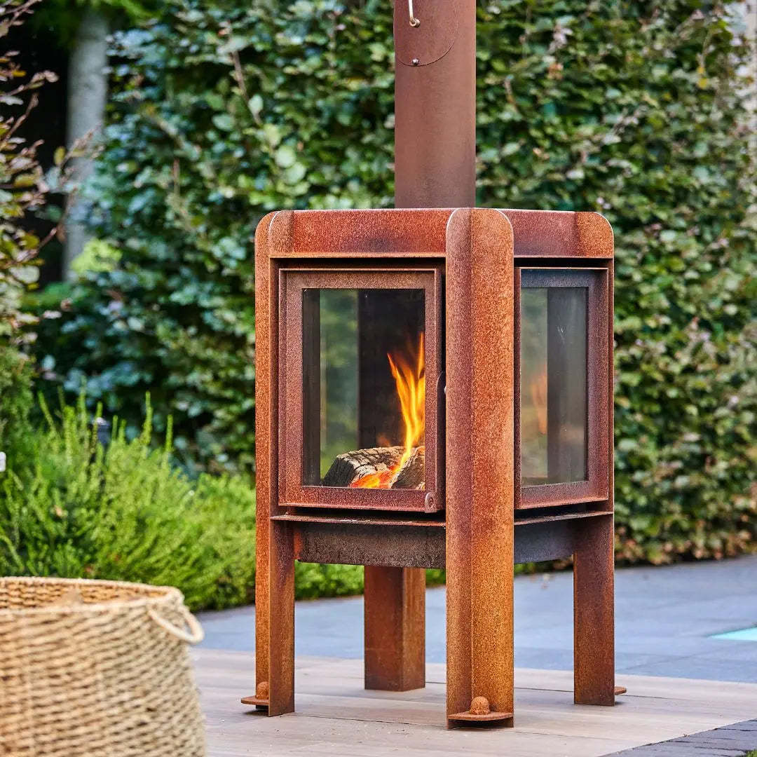 RB73 Fennek 50 Outdoor Fireplace - Compact CorTen Steel Wood Burner on outdoor patio setting