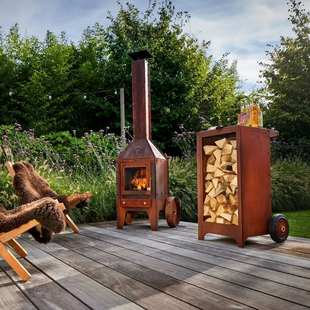 RB73 Ker Mobile CorTen Steel Log Storage on decking with RB73 outdoor fireplace