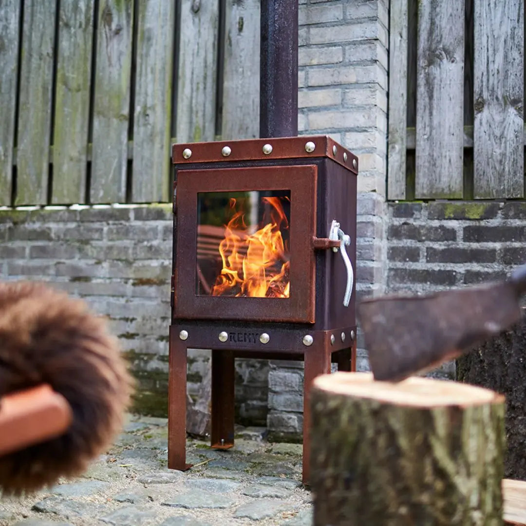 RB73 Piquia Outdoor Fireplace - Compact CorTen Steel Log Burner on outdoor patio setting