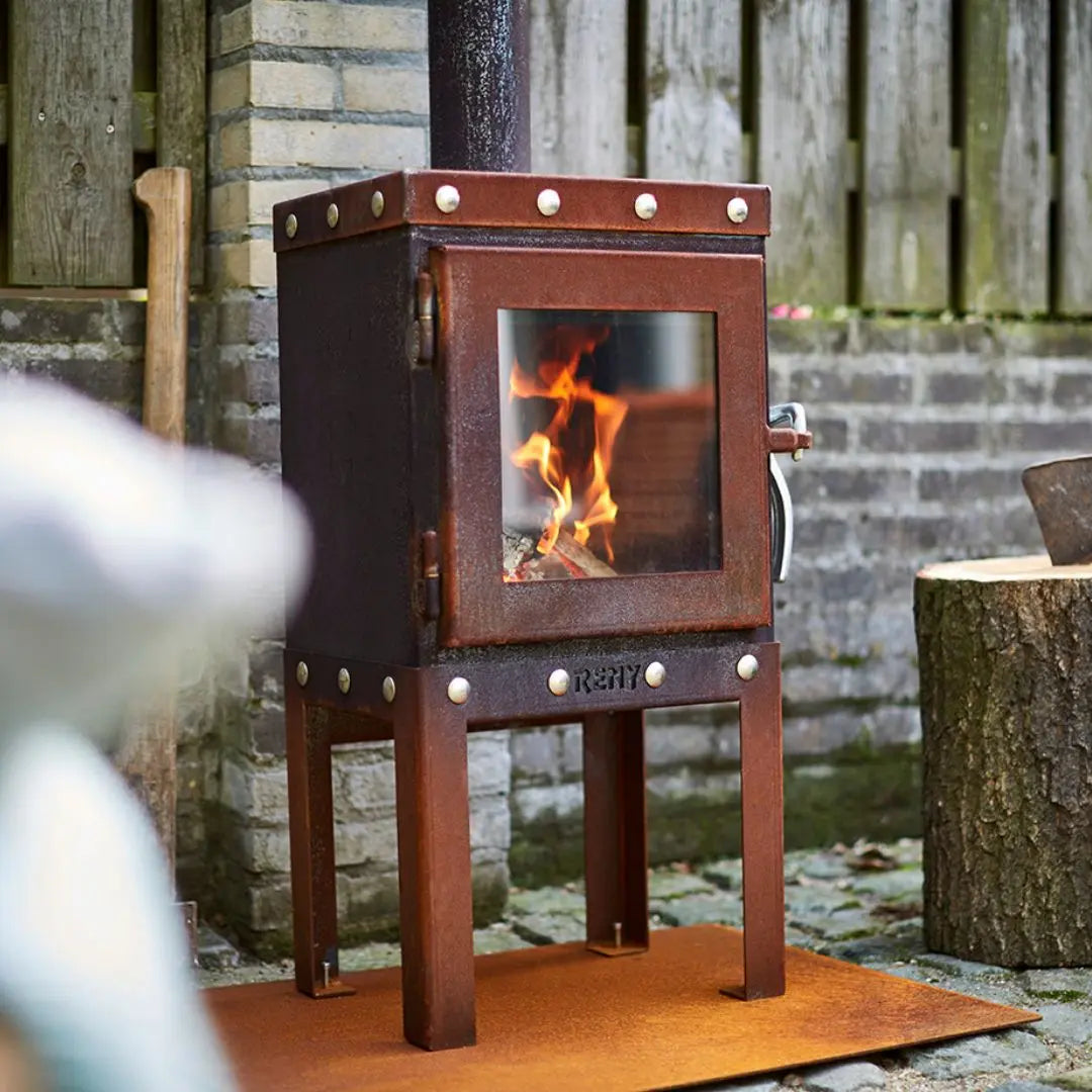 RB73 Piquia Outdoor Fireplace - Compact CorTen Steel Log Burner on outdoor patio setting